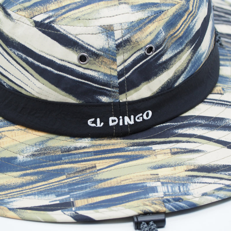 Bucket hat with abstract pattern and 'El Dingo' branding on a white background